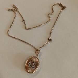 Beautiful 26 inch long 14 karat gold chain with beautiful filigree locket.